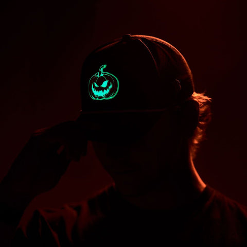 Jack-O-Lantern Glow Curved Trucker  Black, Charcoal, Heather Gray, Navy